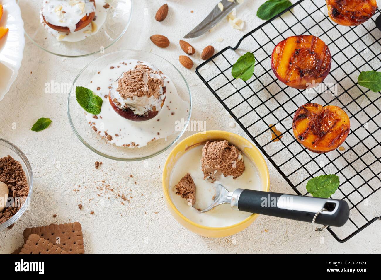 Grilled peaches summer dessert American bbq. Served with almonds, ice