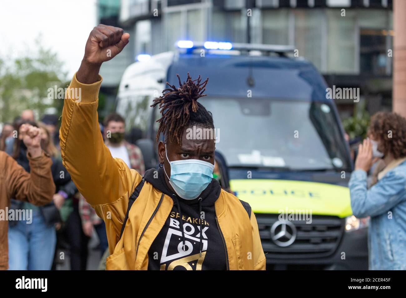 Marching protester with fist clenched, Black Lives Matter demonstration, London, 29 August 2020 Stock Photo