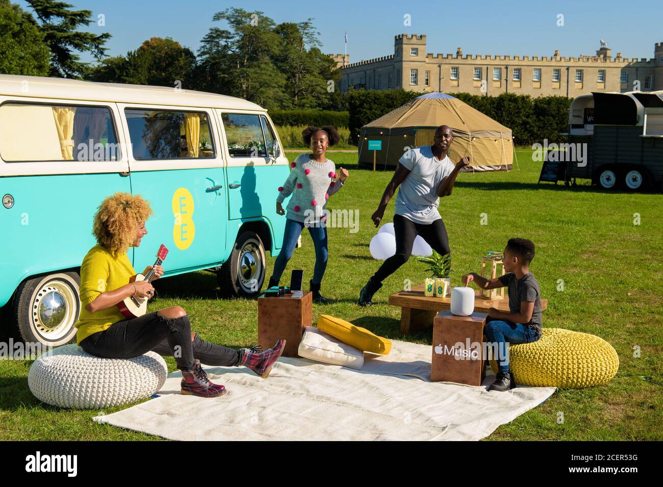 EDITORIAL USE ONLY The Knight family (Left to right) Anuli, Sahara aged 11,  Kwame, and Kayden aged 6, try out the experiences on offer in a  technology-enhanced campervan at Syon House to