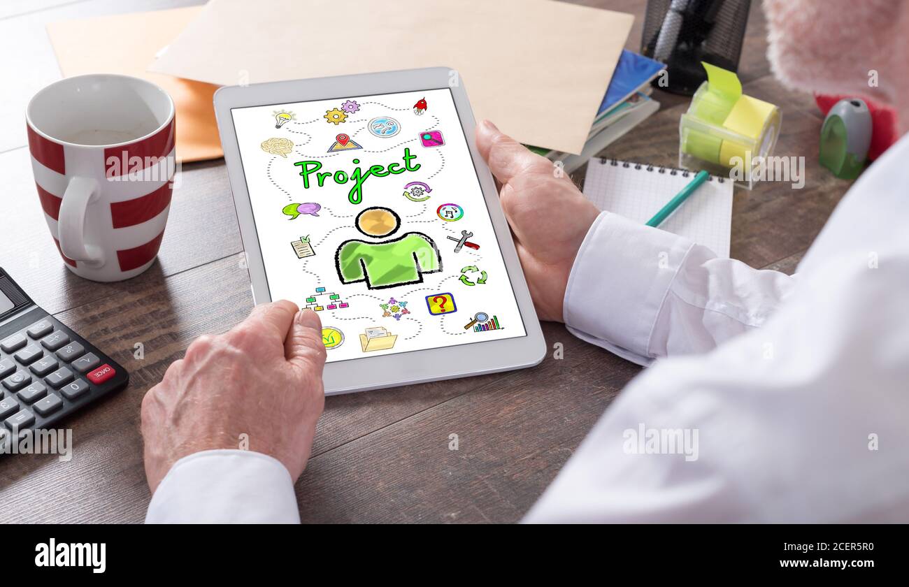 Project concept shown on a tablet held by a man Stock Photo