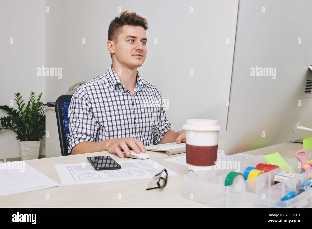UI designer working on computer Stock Photo