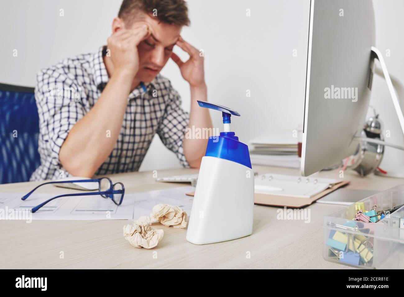 Hand sanitizer on desk Stock Photo