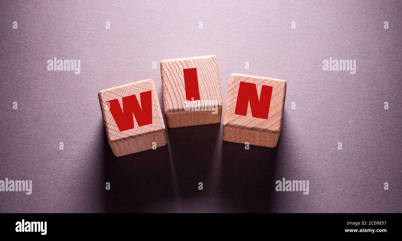 Win Word Written on Wooden Cubes Stock Photo