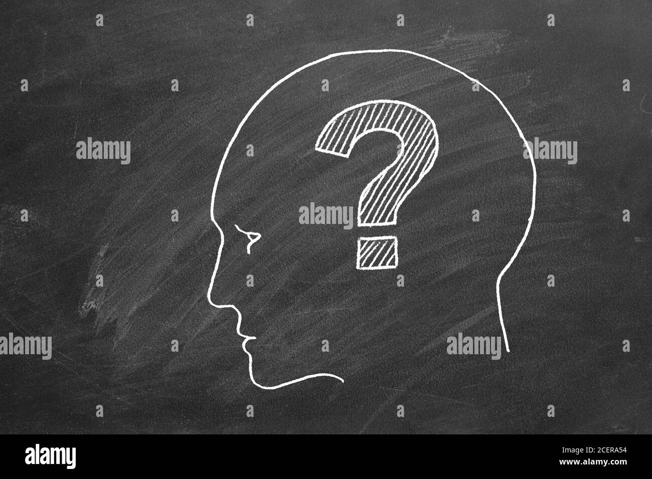 Human face with question mark inside. Illustration on blackboard. Stock Photo