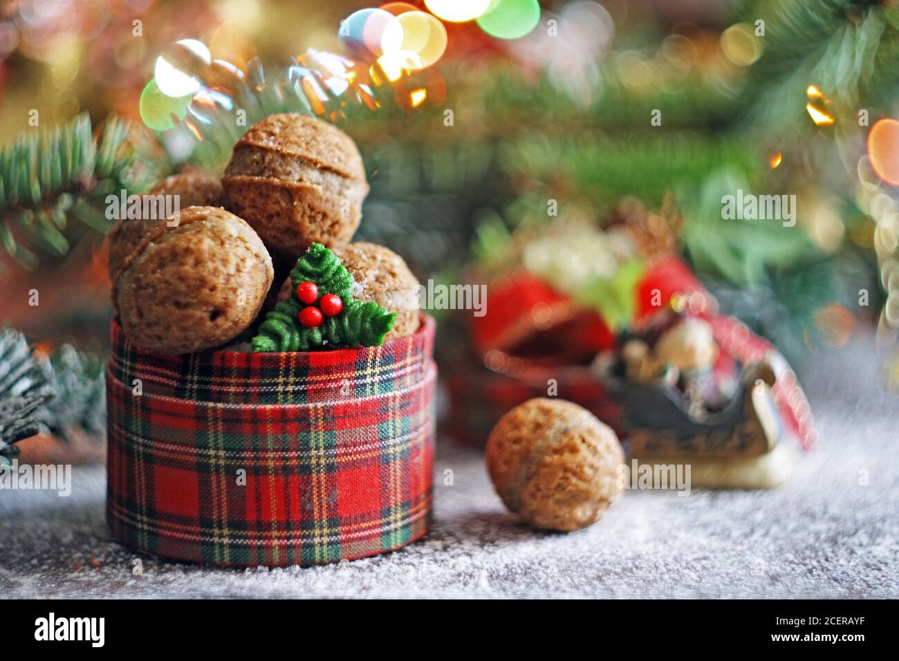 Walnut shaped cookies in Christmas plaid box. Selective focus Stock Photo