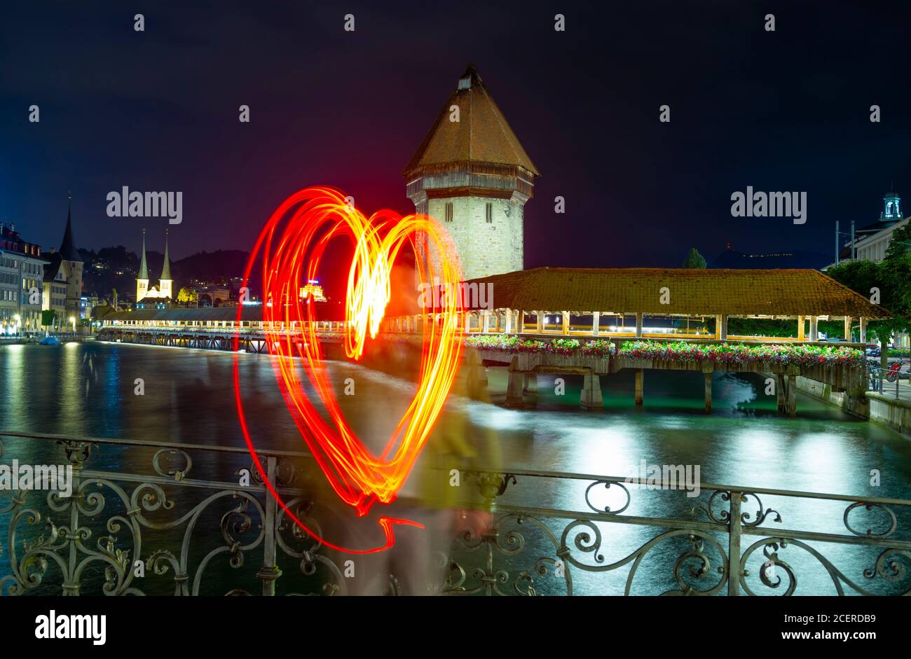 City of Lucerne with Chapel Bridge and Heartshape at Night in Switzerland. Stock Photo