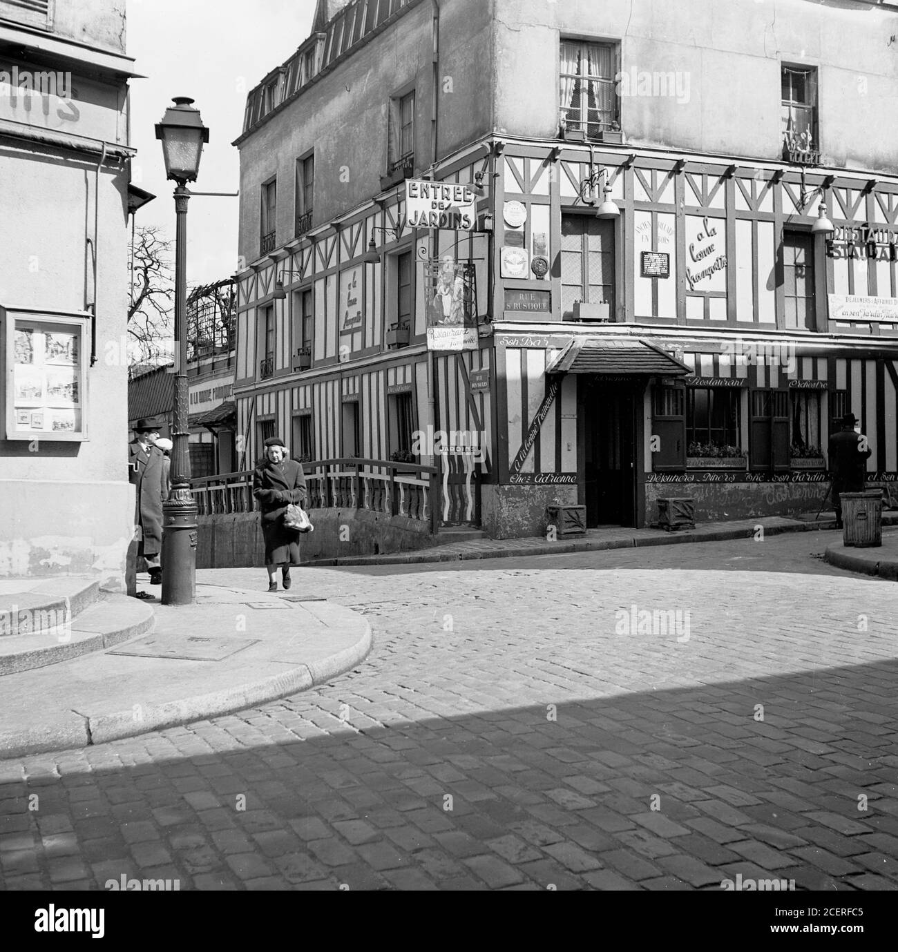 1950s, historical, Paris, France, cobbled street and buildings in the