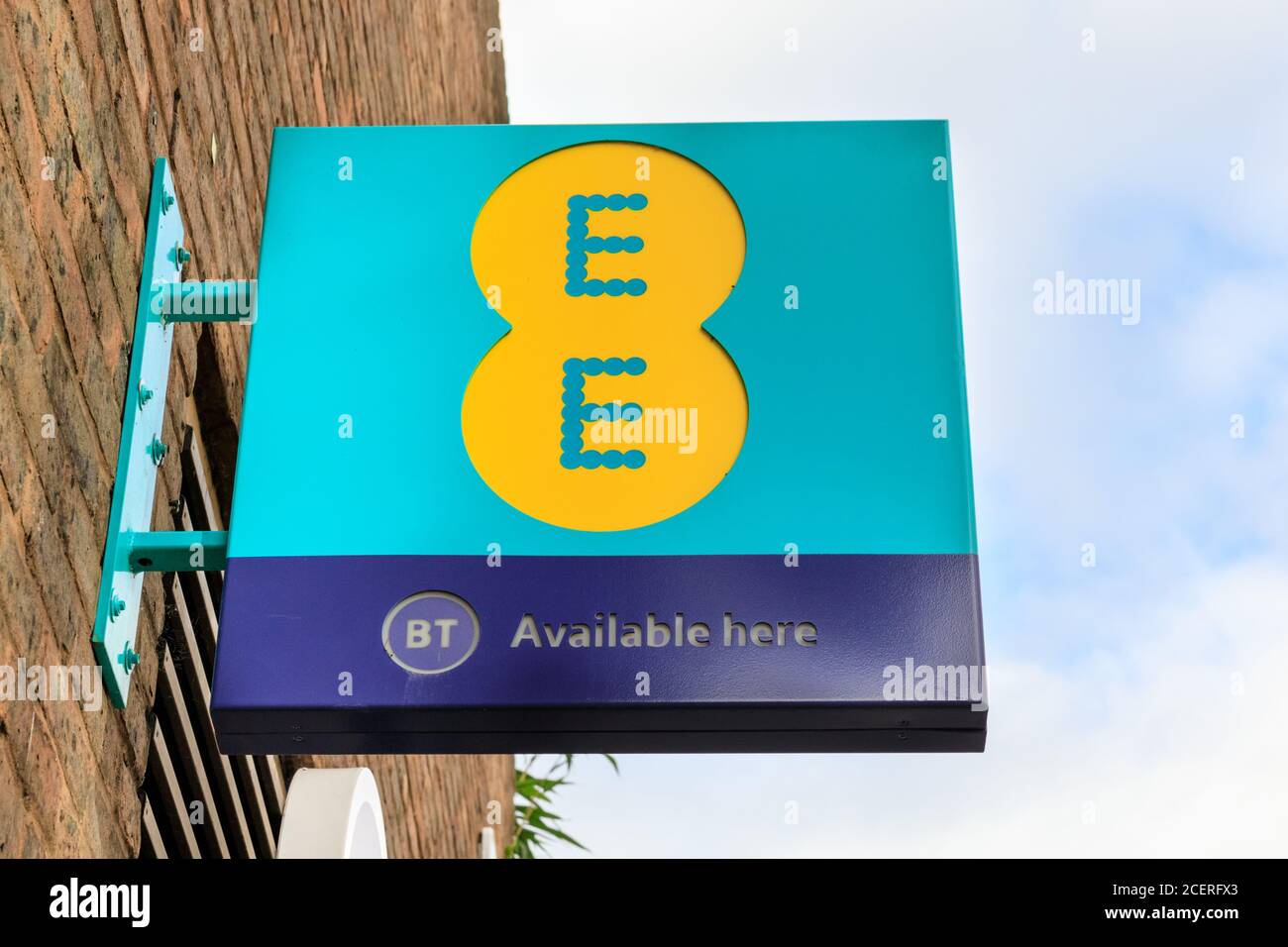 EE telecoms and mobile phone corporate logo and sign outside shop in London, England, UK Stock Photo