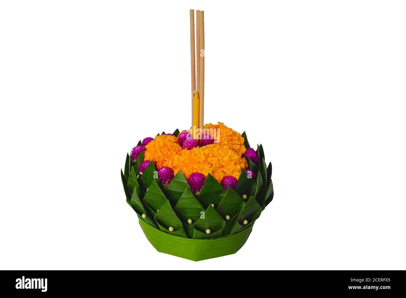 Banana leaf Krathong that have 3 incense sticks and candle decorates with flowers for Thailand full moon or Loy Krathong festival isolated on white ba Stock Photo