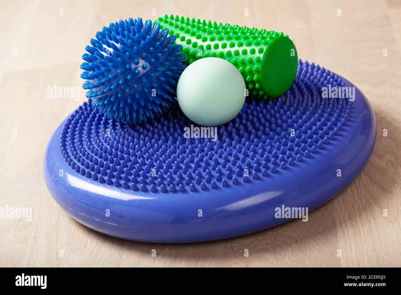 massage rubber balls, balance cushion and roller for self massage and reflexology Stock Photo