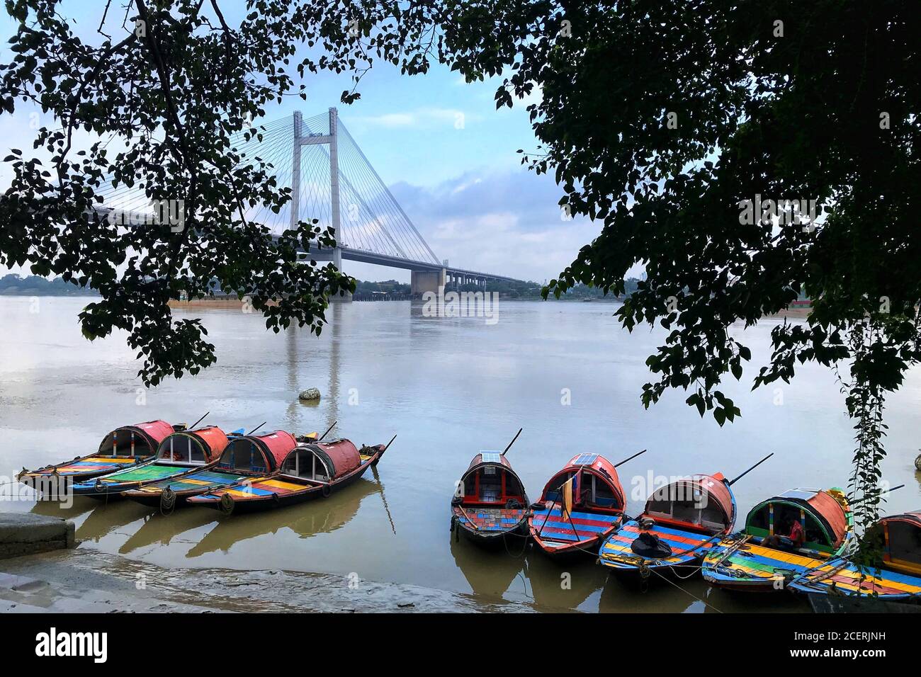 Empty boats seen on the river Ganges at Princep Ghat near Vidyasagar Setu during lockdown period Stock Photo