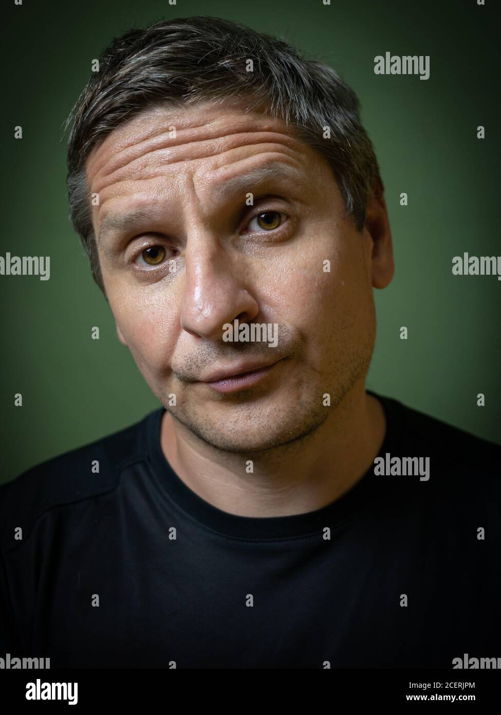 Studio portrait of no smiling 40 years old white (caucasian) man. Rembrandt lighting. Magazine cover style. Stock Photo
