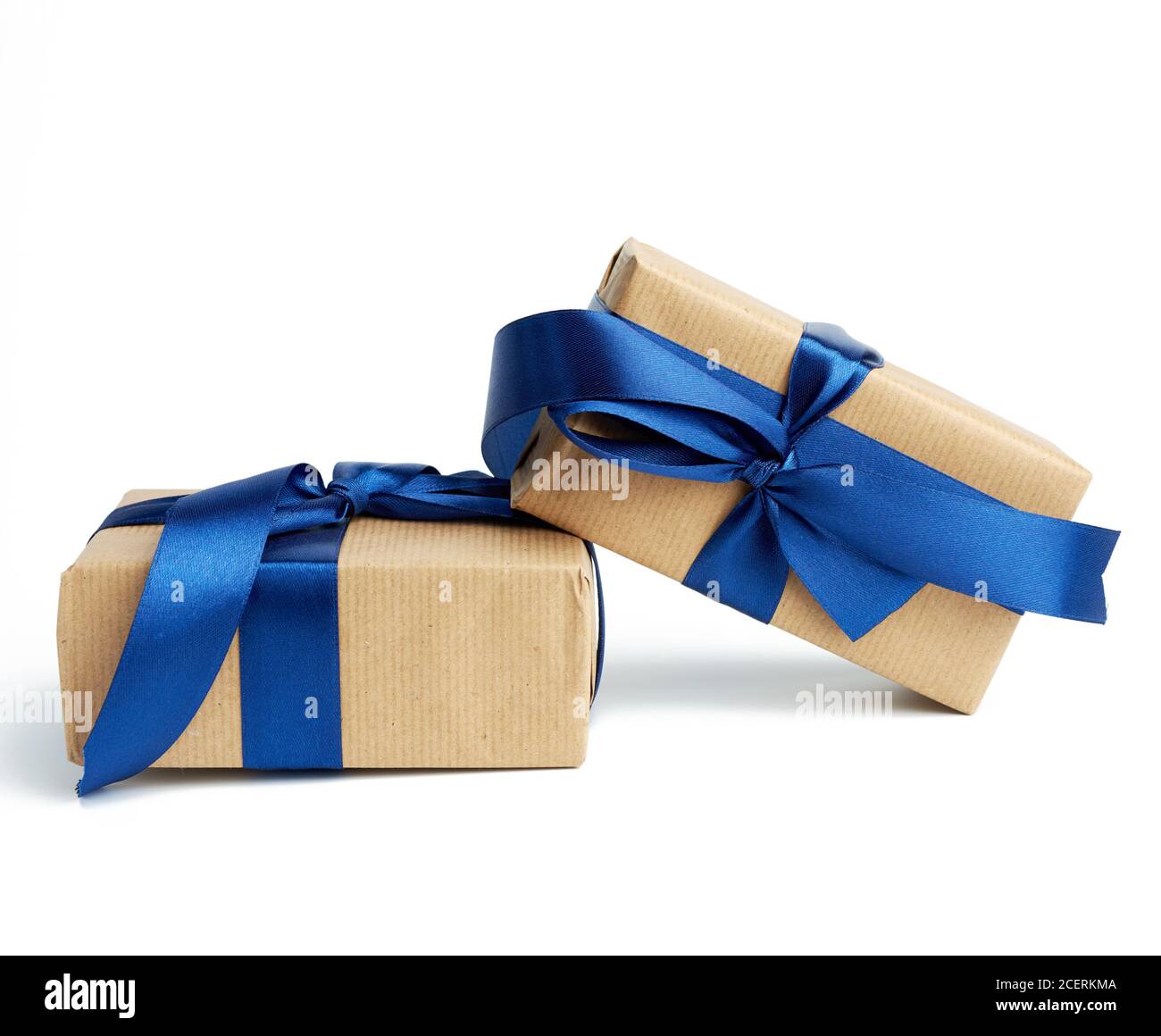 stack of wrapped boxes in brown kraft paper and tied with silk blue