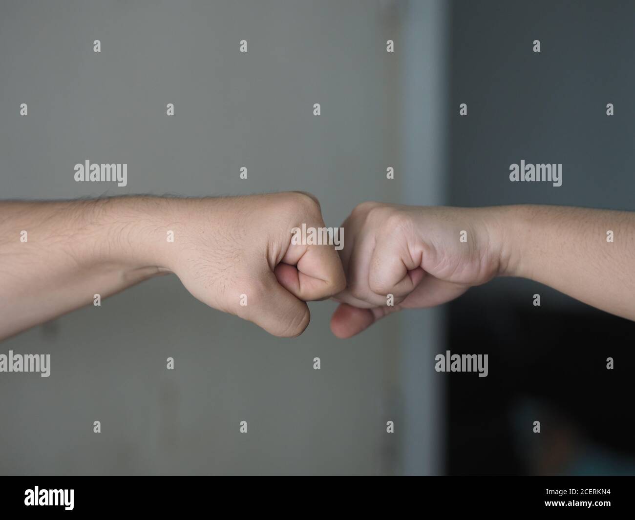 Two Woman Alternative Handshakes Fist Collision Bump Greeting In The 