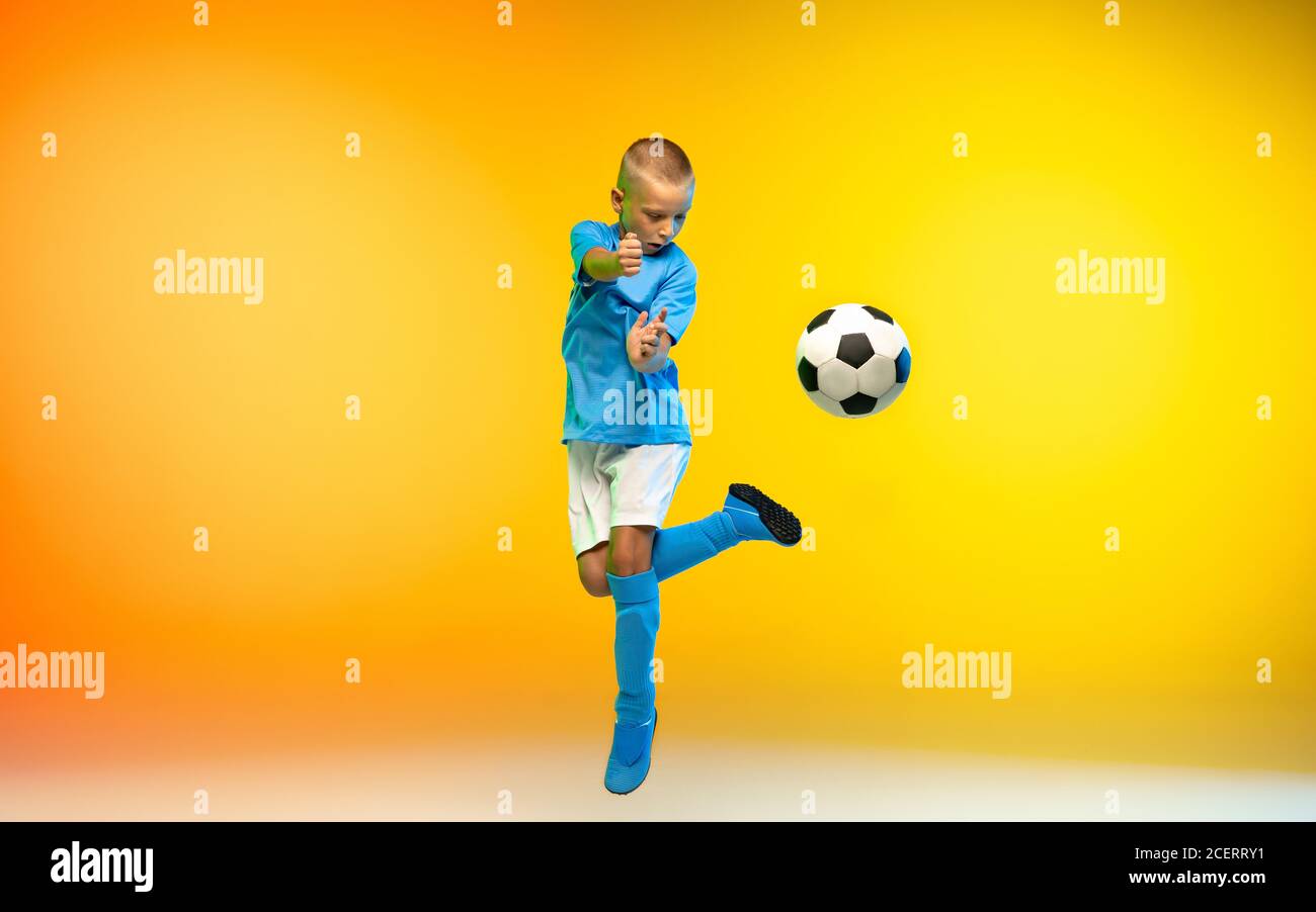 Young Man, Male Athlete in Motion Over Gradient Studio Background