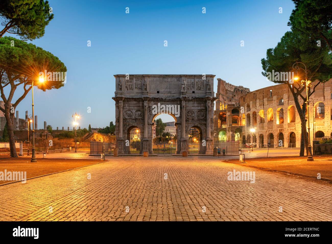 Arch of Constantine and Colosseum at sunrise, Rome, Italy Stock Photo