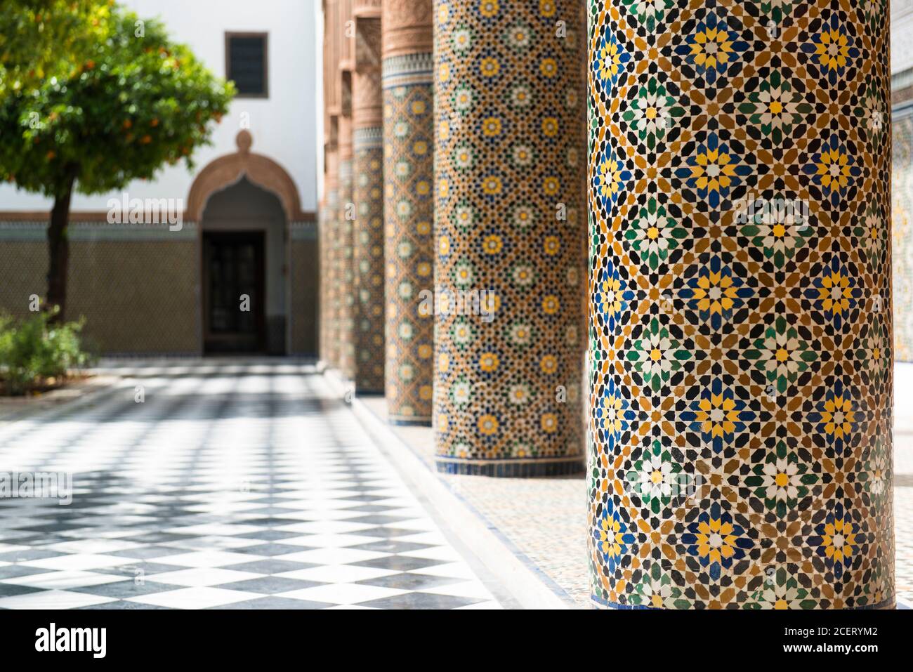Close up ceramic tiling on colums skirting the courtyard of Dar el-Bacha Palace, Medina, Marrakesh Stock Photo