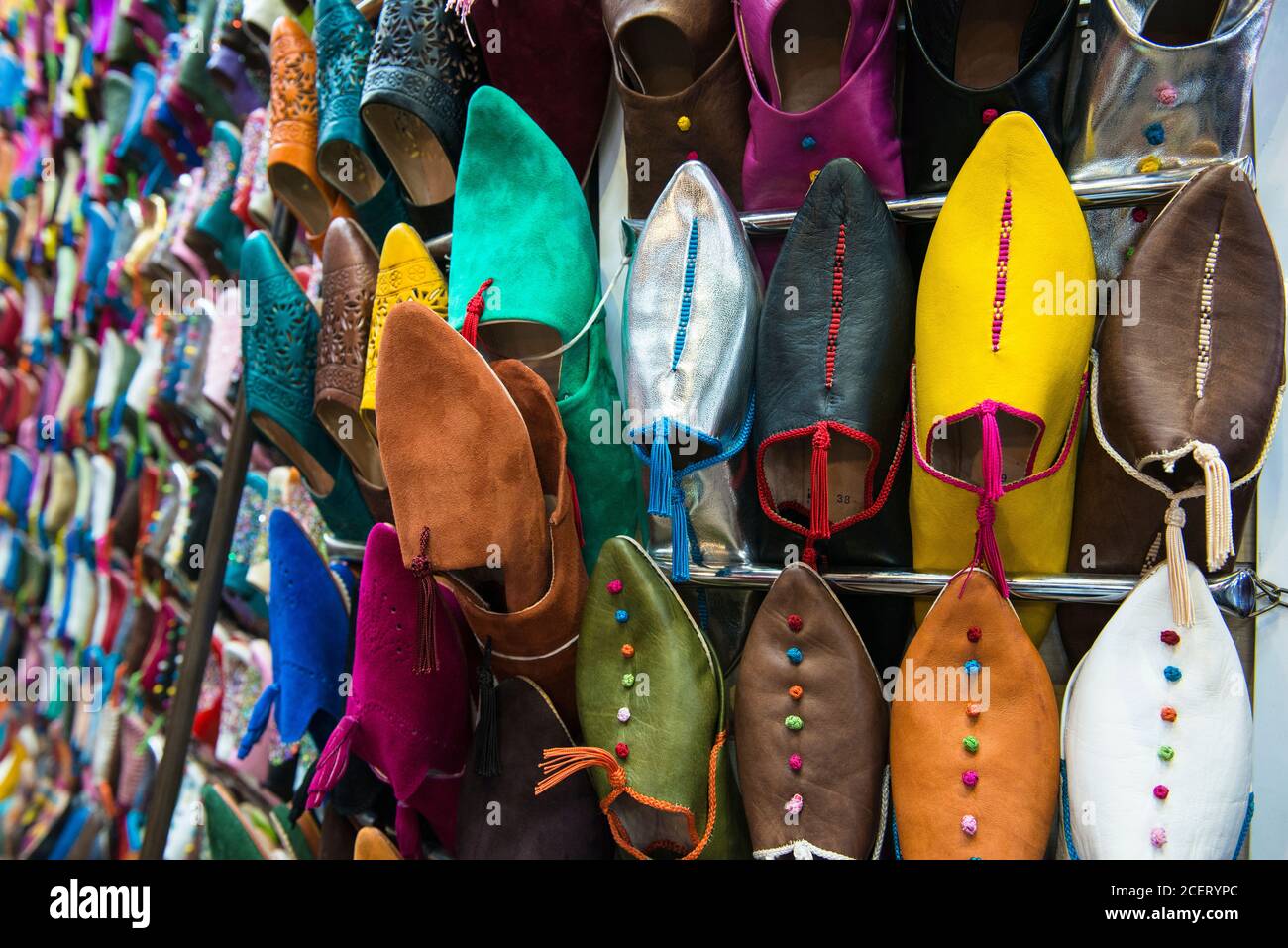 Leather babouches, Moroccan backless leather slippers for sale in the souk within the Medina,  Marrakesh Stock Photo