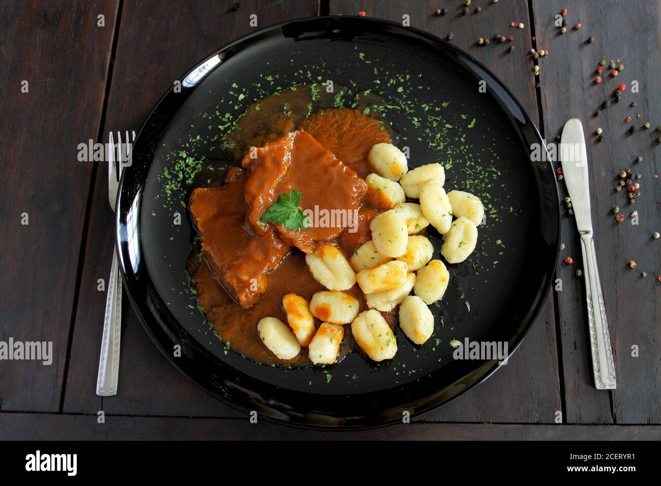 Pasticada with gnocchi, beef stew in a sauce. Croatian cuisine Stock Photo