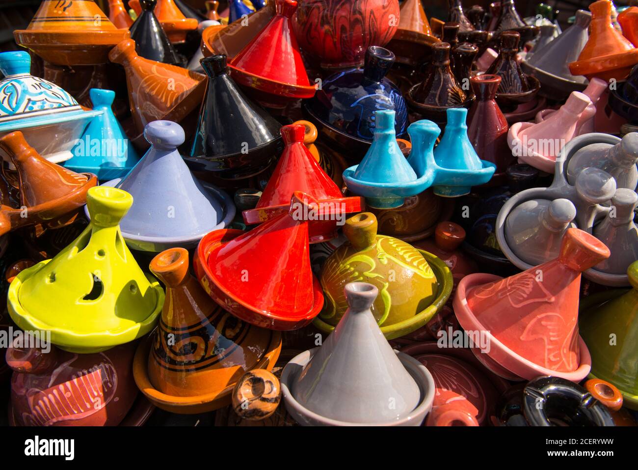Close up of colourful terracotta tagine pots for sale outdoors  in the souk within the Medina, Marrakesh Stock Photo