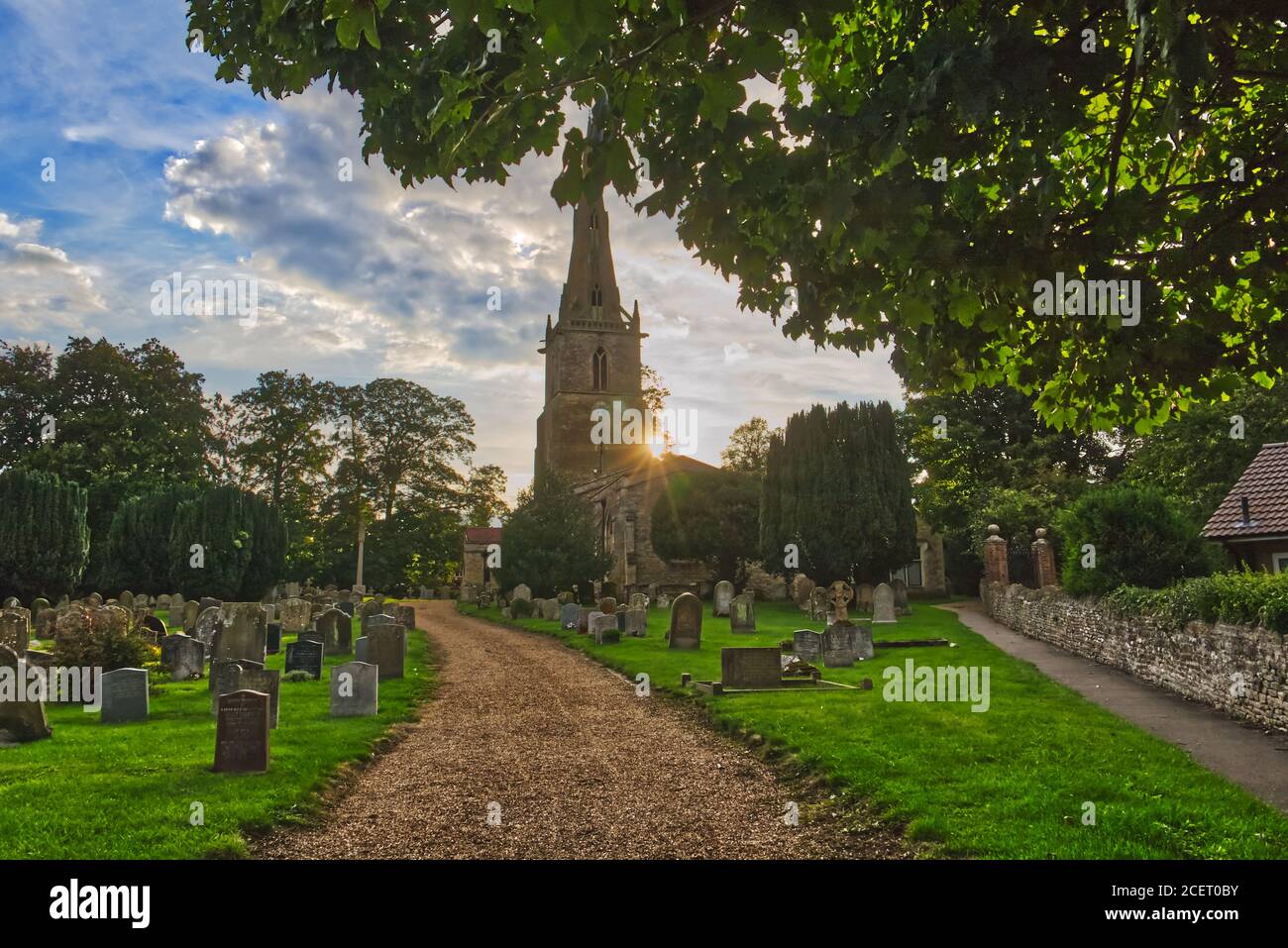 Sunset at St Peter's Church in the village of Sharnbrook, Bedfordshire, England, UK Stock Photo