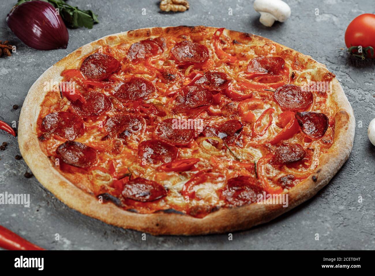 Thinly sliced pepperoni is a popular pizza topping in Americanstyle pizzerias Stock Photo Alamy