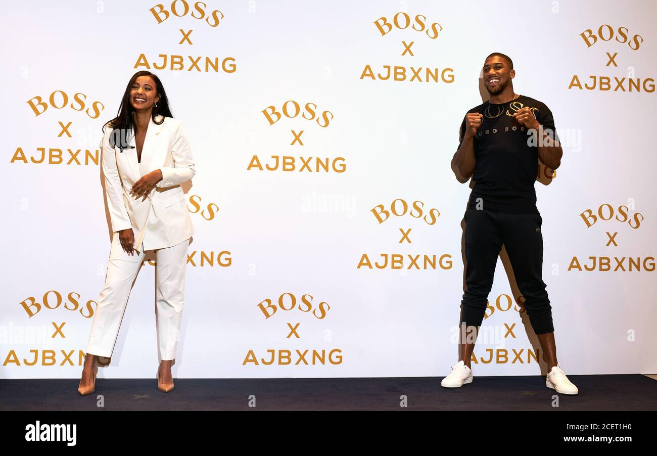 Boxer Anthony Joshua with presenter Maya Jama at the Hugo Boss store on  Regent Street, London Stock Photo - Alamy