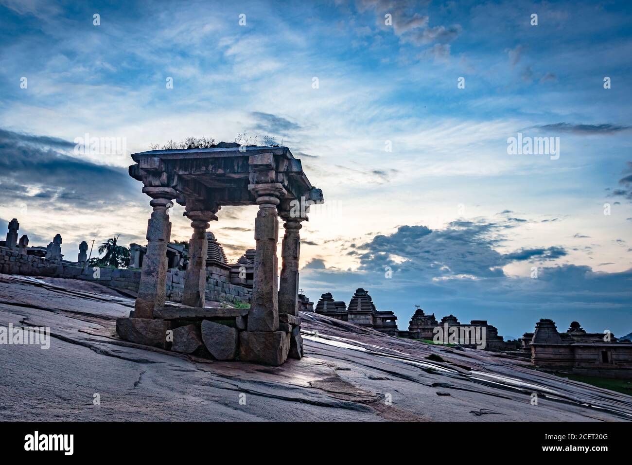 hampi ruins ancient stone art with amazing dramatic sky image is taken at hampi karnataka india. it is showing the impressive architecture in hampi. Stock Photo