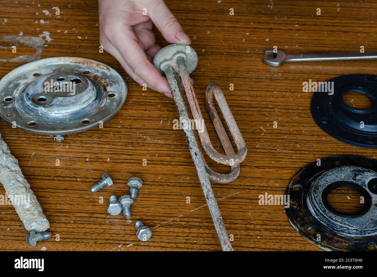 Qualified repair of a water heater. Locksmith performs inspection