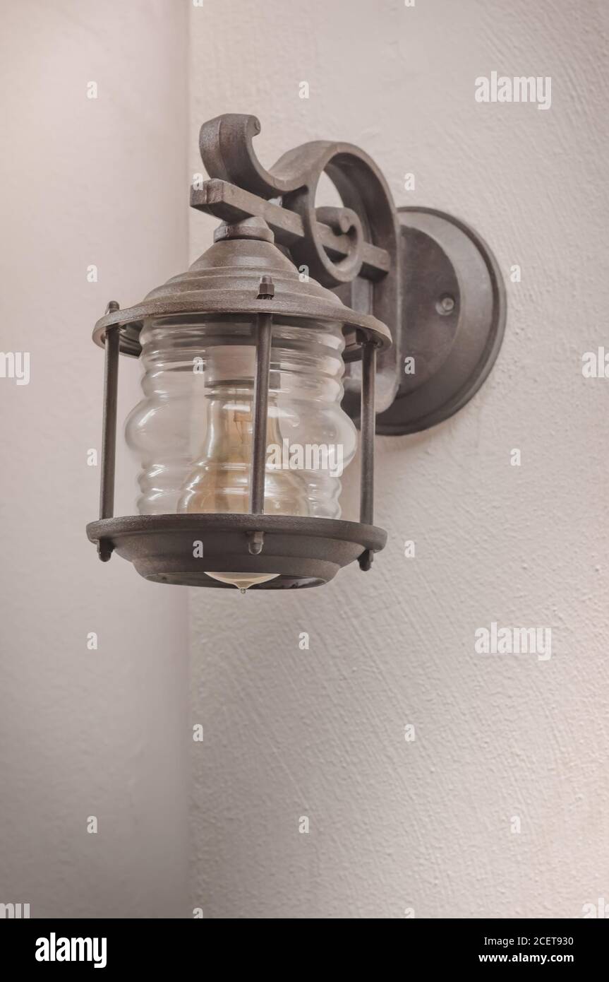 Wall metal lamp with an electric bulb Stock Photo