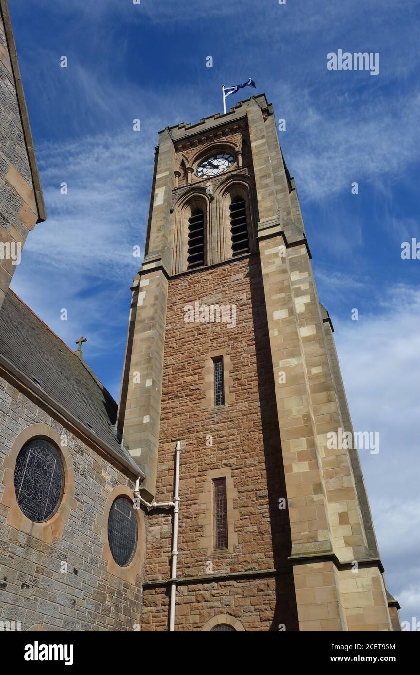 Clock Tower and flag, st Andrew Blackadder Church, North Berwick Stock