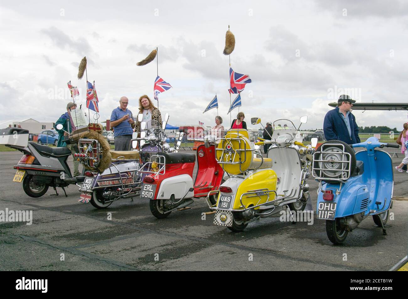 A line-up of old motor scooters on display at a Country Fair in Gloucestershire England UK Stock Photo