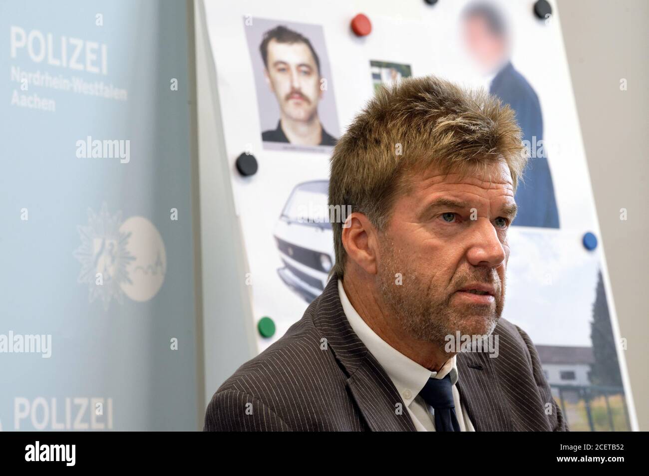 Aachen, Germany. 02nd Sep, 2020. Gerhard Hoppmann, Chief Inspector of the Krefeld Criminal Investigation Department, sits at a press conference to identify a previously unknown murder victim. With the help of a new sketch (back, left), police have clarified the identity of a murder victim found more than 23 years ago in the Lower Rhine area. The decisive clue came after a broadcast of 'File number XY . unsolved'. Credit: Henning Kaiser/dpa - ATTENTION: An image in the background was pixelated for legal reasons/dpa/Alamy Live News Stock Photo