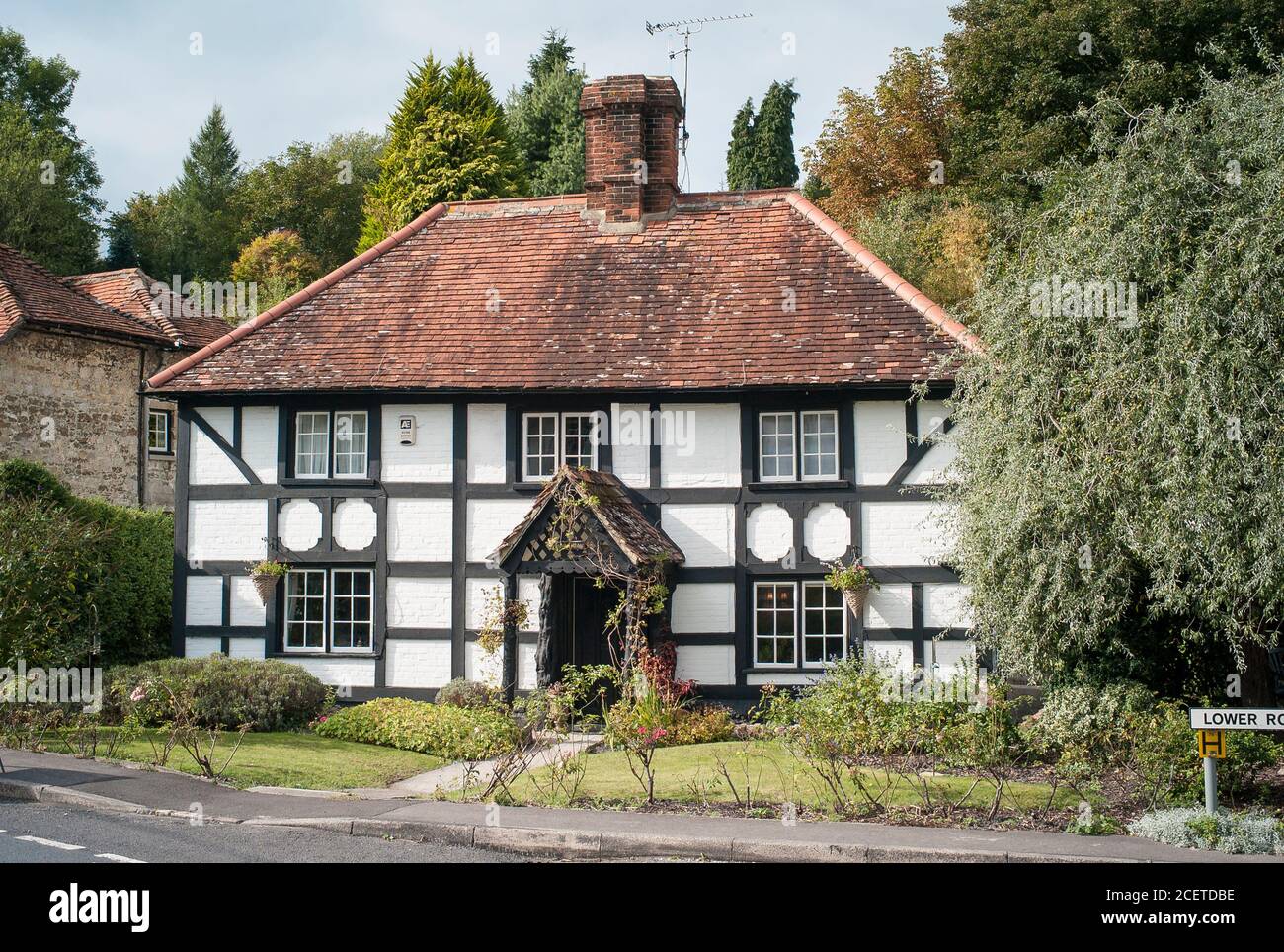 A pretty detached village cottage in Erlestoke Wiltshire England UK Stock Photo