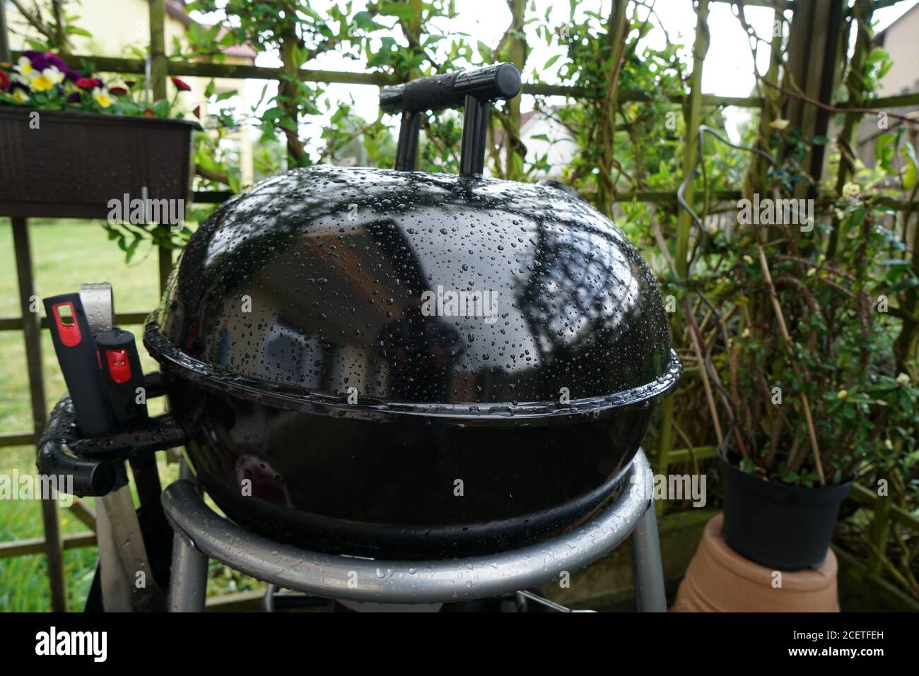 Closeup shot of a black barbeque grill machine outdoors Stock Photo - Alamy