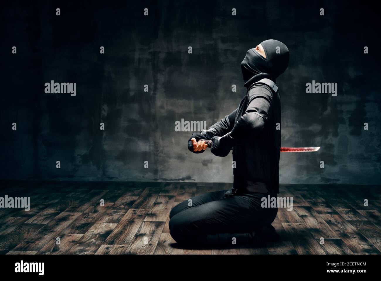 Japanese Ninja doing harakiri, seppuku. Suicide concept Stock Photo