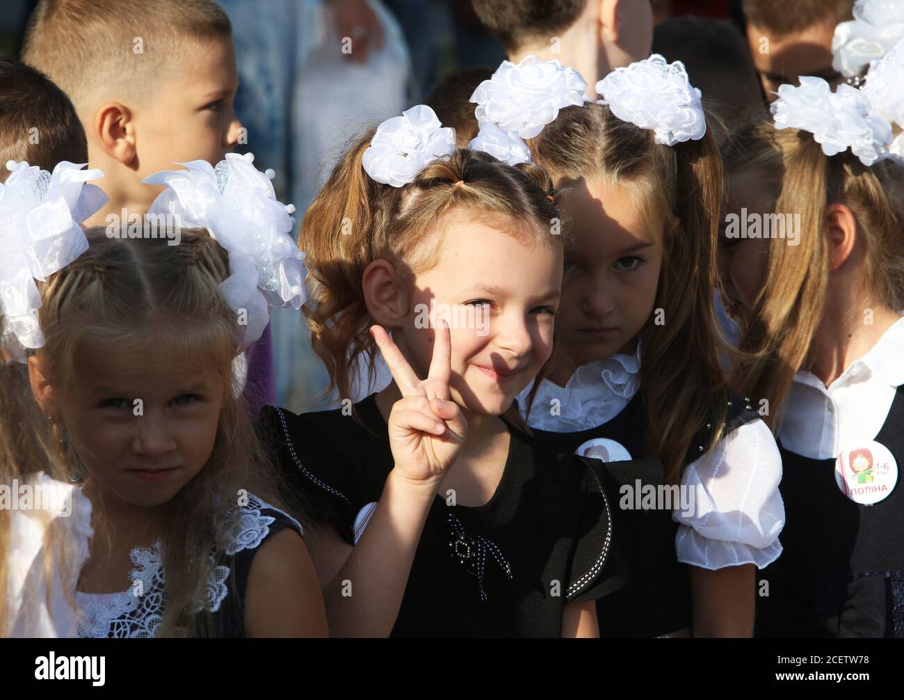 Kiev. 1st Sep, 2020. A girl gestures on her first day of school in Kiev Oblast, Ukraine, Sept. 1, 2020 Over 4.2 million students have resumed their studies in Ukraine, including 428,000 first-graders, as the country marks the start of the new school year. Children from the 21 cities and districts in 'red' quarantine zones will not return to school in person, instead studying remotely until the epidemiological situation changes. Credit: Sergey Starostenko/Xinhua/Alamy Live News Stock Photo