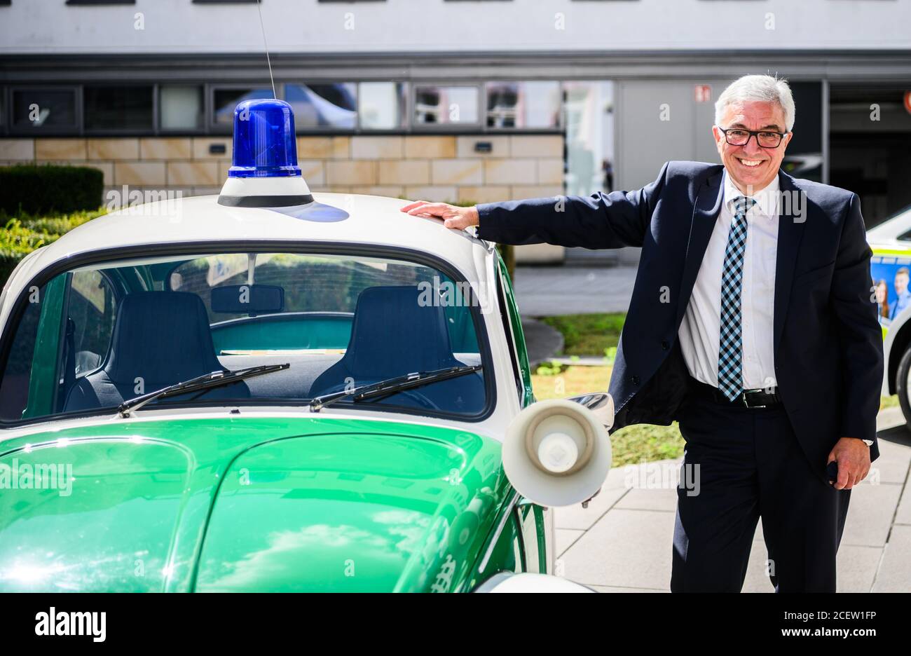 Mainz, Germany. 02nd Sep, 2020. Roger Lewentz (SPD), Minister of the Interior of Rhineland-Palatinate, is standing next to a historic police emergency vehicle (VW Beetle, built 1976). The Minister of the Interior of Rhineland-Palatinate presented the future police emergency vehicles. The police vehicle is an Audi A 6 with a new visual appearance. Credit: Andreas Arnold/dpa/Alamy Live News Stock Photo