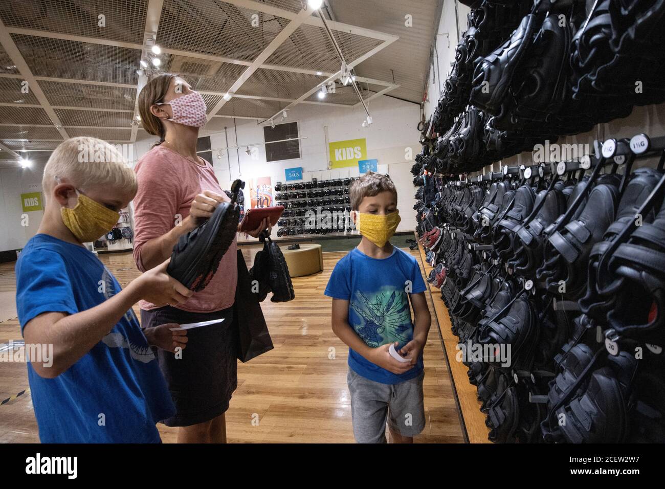 Back to School, a mother and sons buying their back to school shoes at a Clarks shoes outlet in Somerset, England, United Kingdom Stock Photo - Alamy