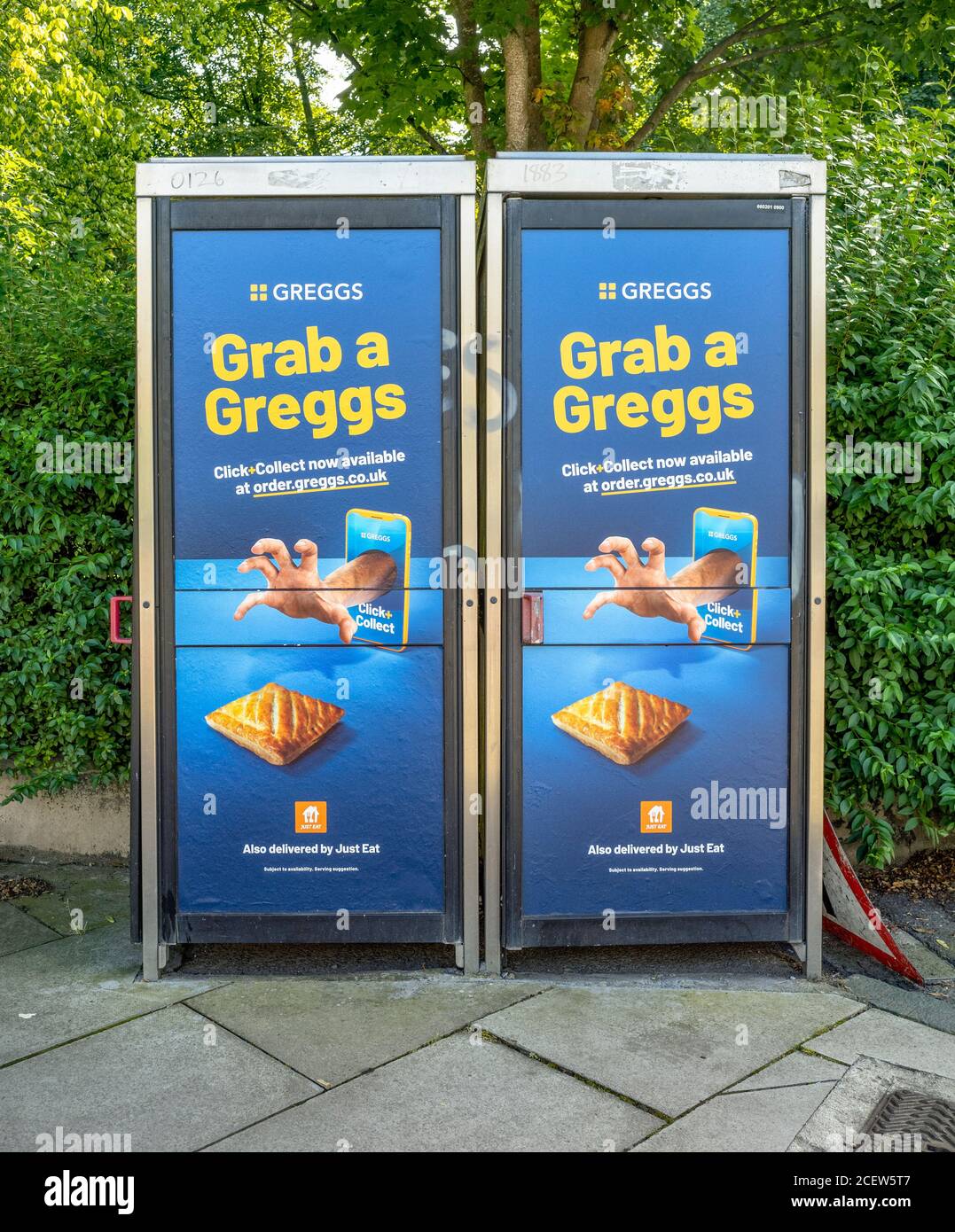 Advert for Greggs on two Edinburgh Telephone Boxes. Stock Photo