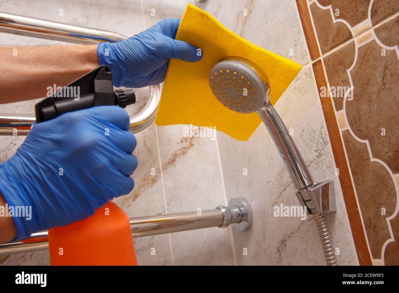 Cleaning chrome bathroom elements with a special tool for removing ...