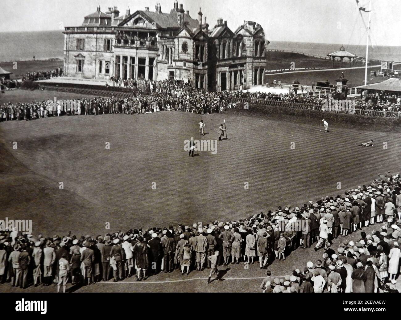 A 1933 printed illustration showing a game of golf taking place at St Andrews Golf Course, Scotland in front of the clubhouse. It wasn't until   18 September 2014, the club voted in favour of admitting female members.  Lady Bonallack became the first woman member  to take part in a match Stock Photo