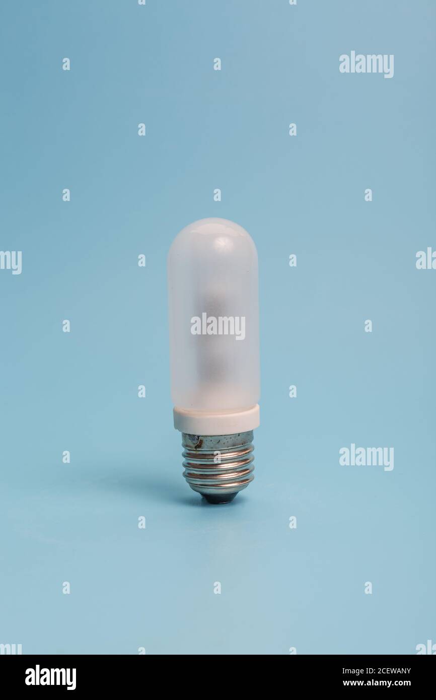 Glass bulb on blue background Stock Photo