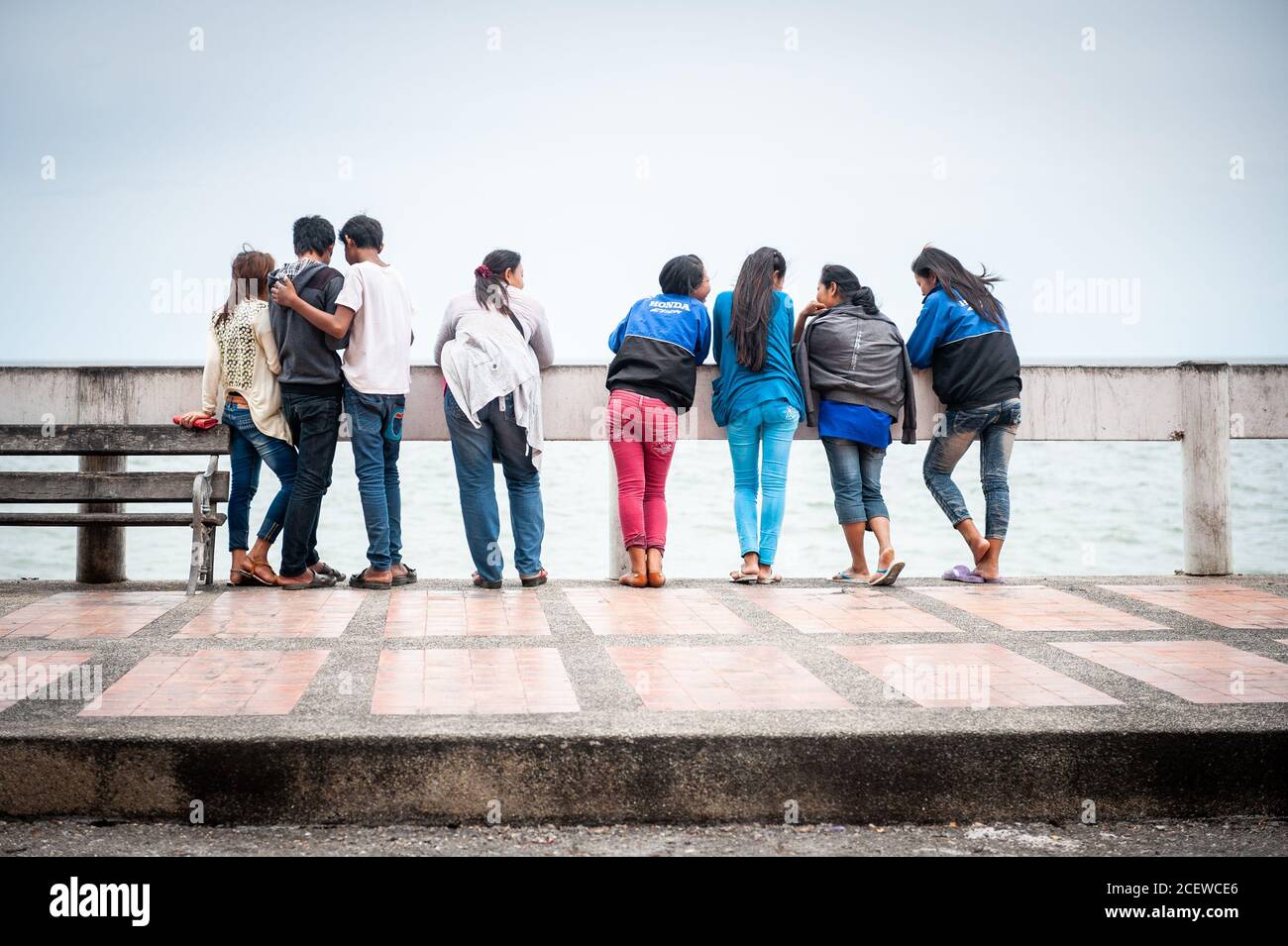 A gang of Thai teenagers hang out at a pier in Bang Saen, near Pattaya  Thailand Stock Photo - Alamy