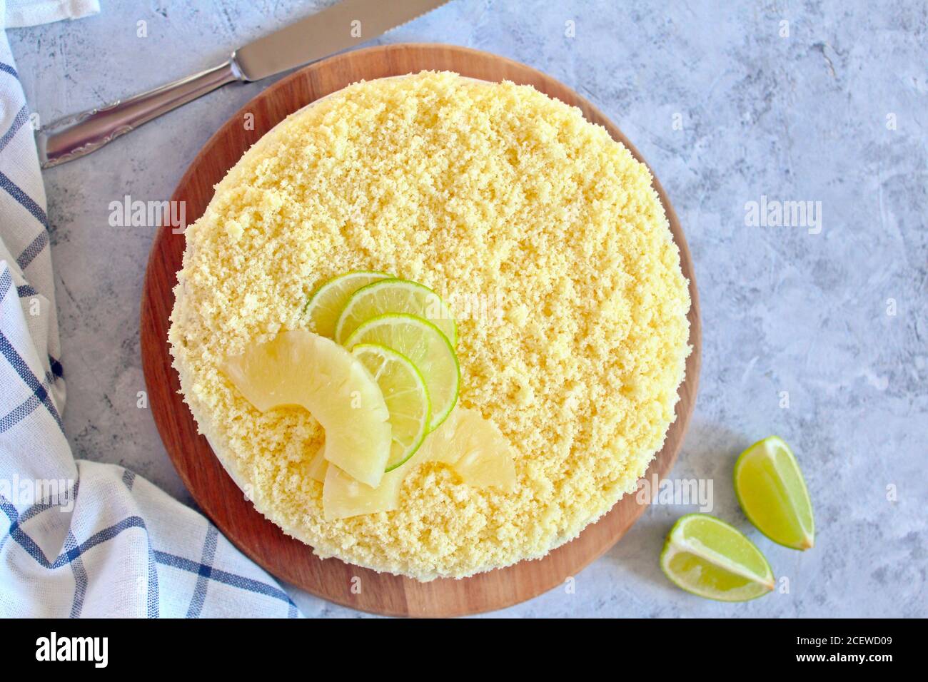 Mimosa cake with ananas. Top view with copy space. Stock Photo