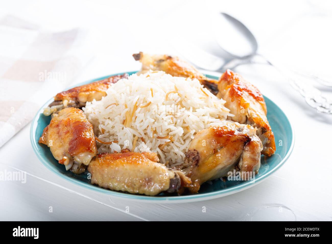 Grilled chicken wings with basmati rice Stock Photo Alamy