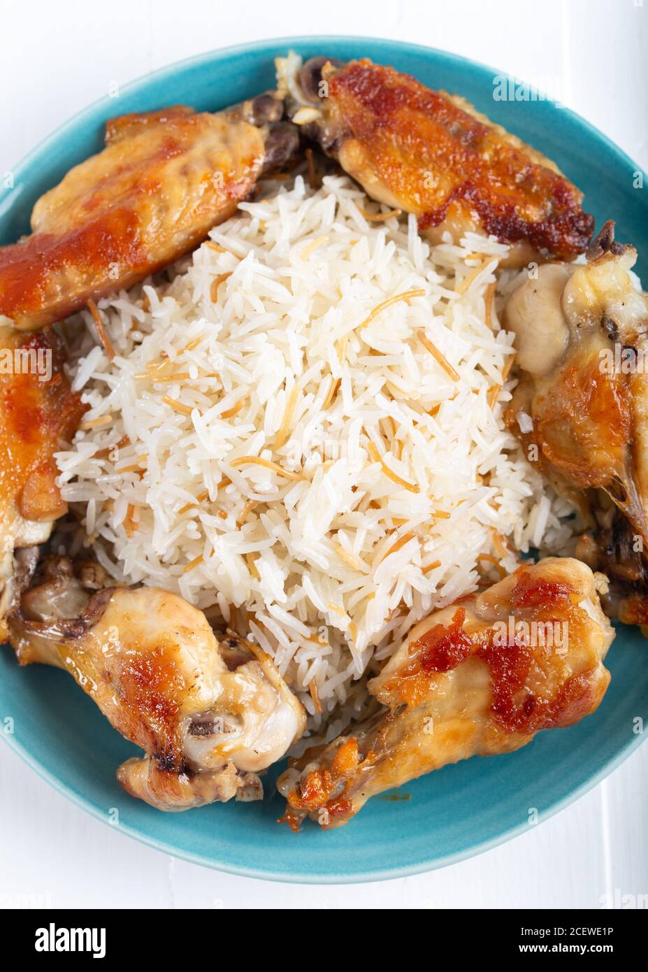 Grilled chicken wings with basmati rice Stock Photo Alamy