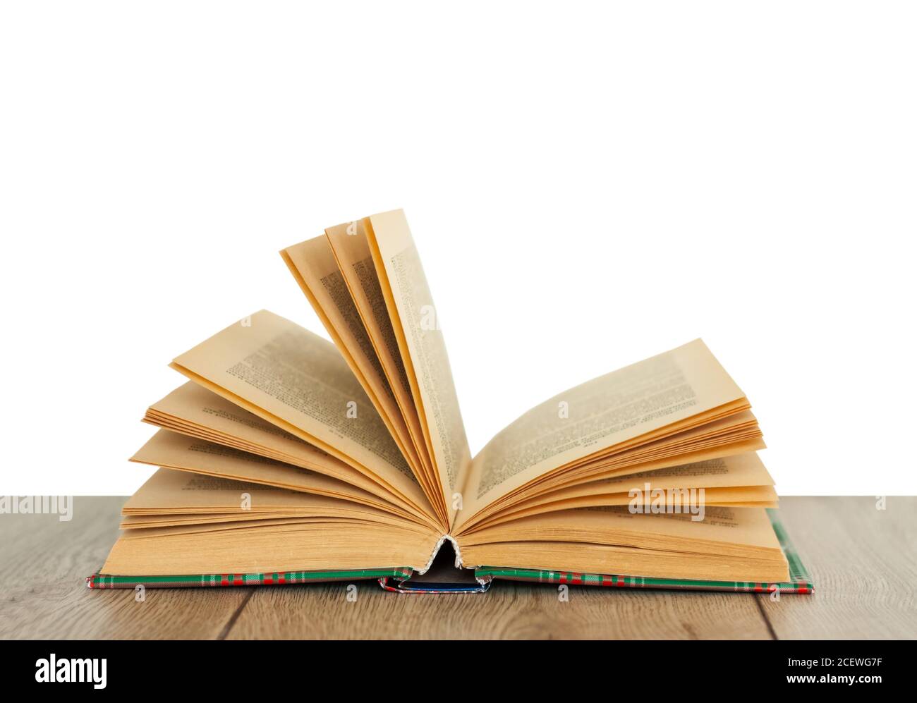 Open book textbook in colorful cover on a white background. Back to school distance home education.Quarantine concept of stay home Stock Photo
