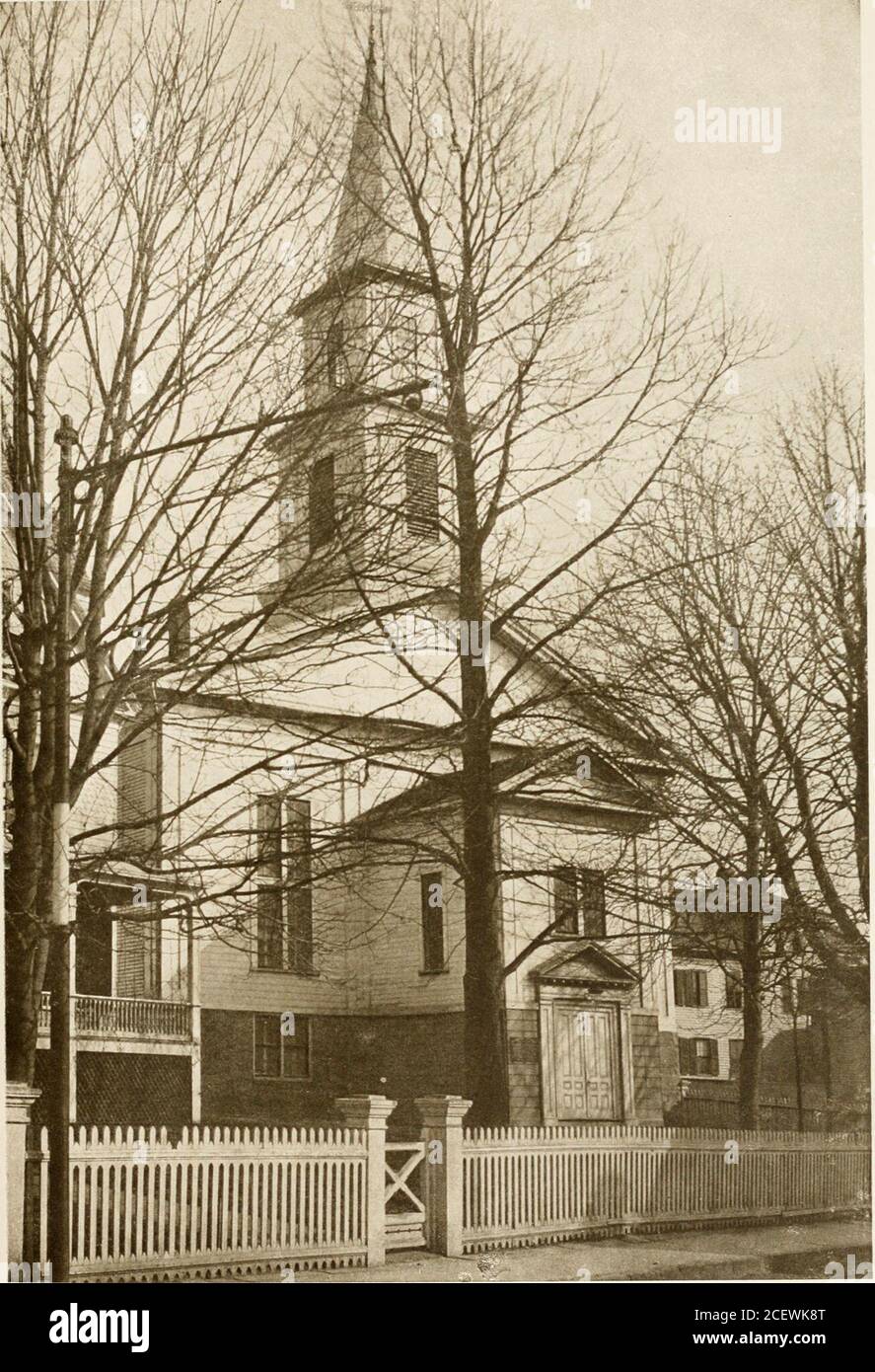 . Old New England churches and their children. to pews on either side.. Fhotograpk by P. H. CaswellFIRST BAPTIST CHURCH, SHOWING PARSONAGE, NEWPORT, RHODE ISLAND First Baptist Church, Providence, R. I. 281 There was an entrance on the south side of thebuilding—doubtless because at high tide thewater flowed nearly up to the west end. The names Brown, Winsor, and Burlingamebecame identified with this pulpit during the fiftyyears that followed. There was a considerabletime of passivity then, and in 1770 the RhodeIsland College, an enterprise of the First BaptistChurch, was transferred to Providen Stock Photo