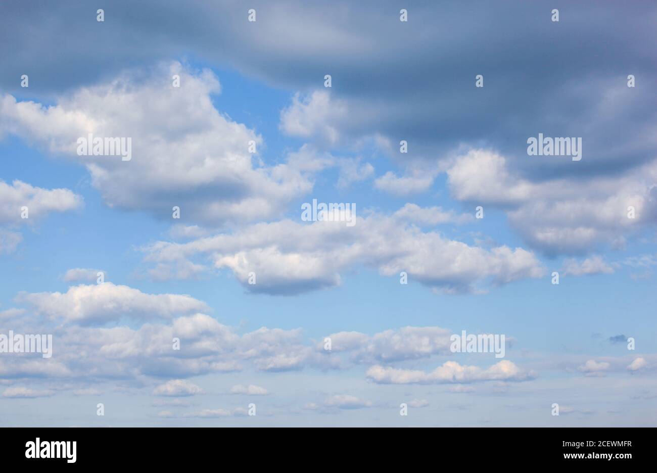 Low angle shot of clouds in the blue sky Stock Photo - Alamy
